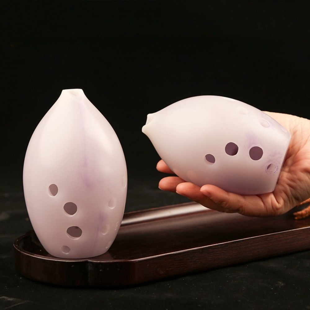 10 fori in resina a forma di p - Musical Instrument Xun recensione e prezzo